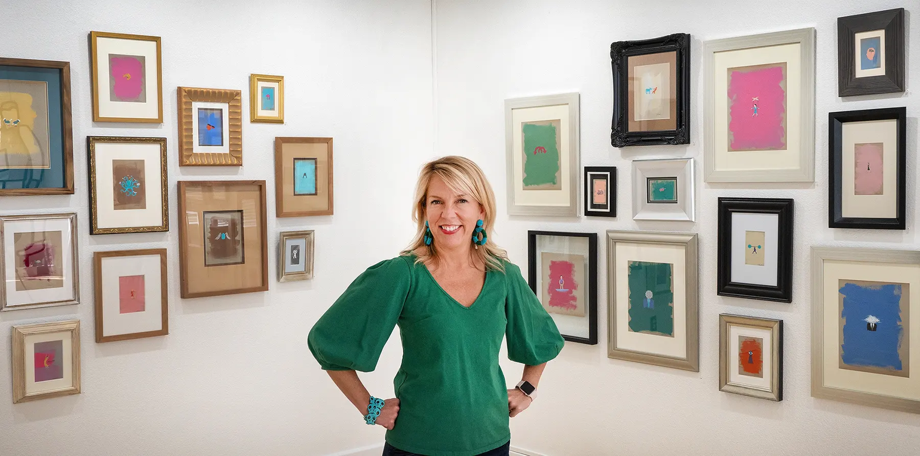 Jennifer standing in her art gallery