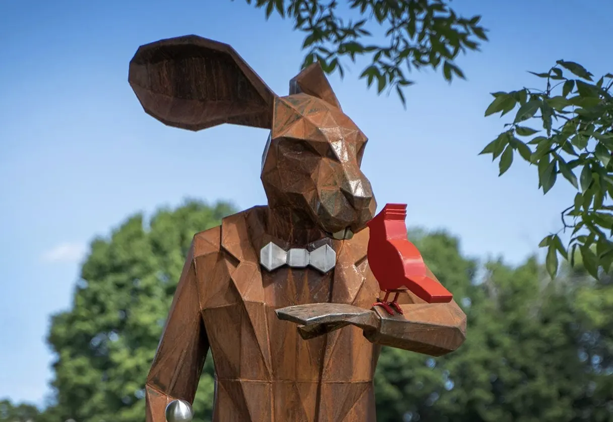 Rabbit Man with bird sculpture