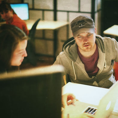 Guy and Lady in front of laptop